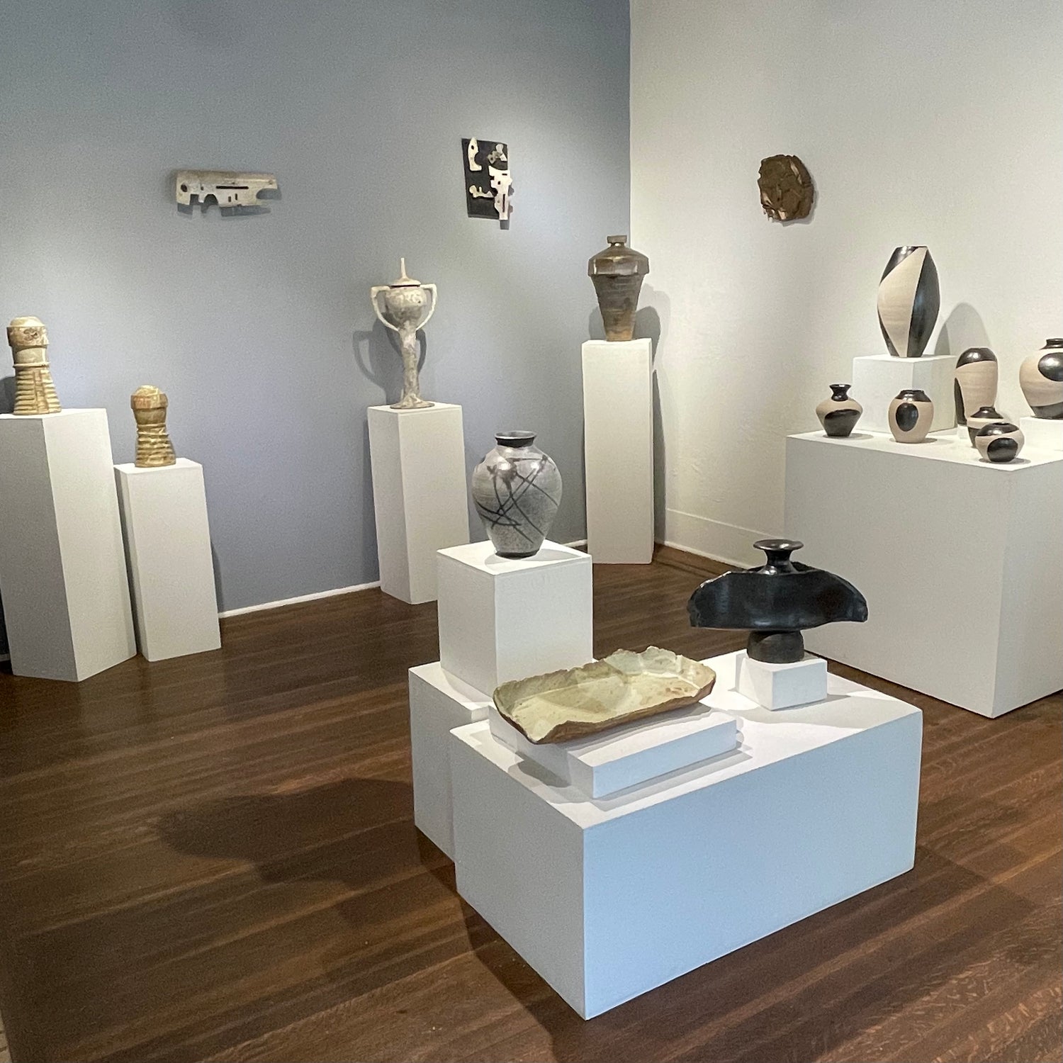View of front gallery room with various ceramic pieces