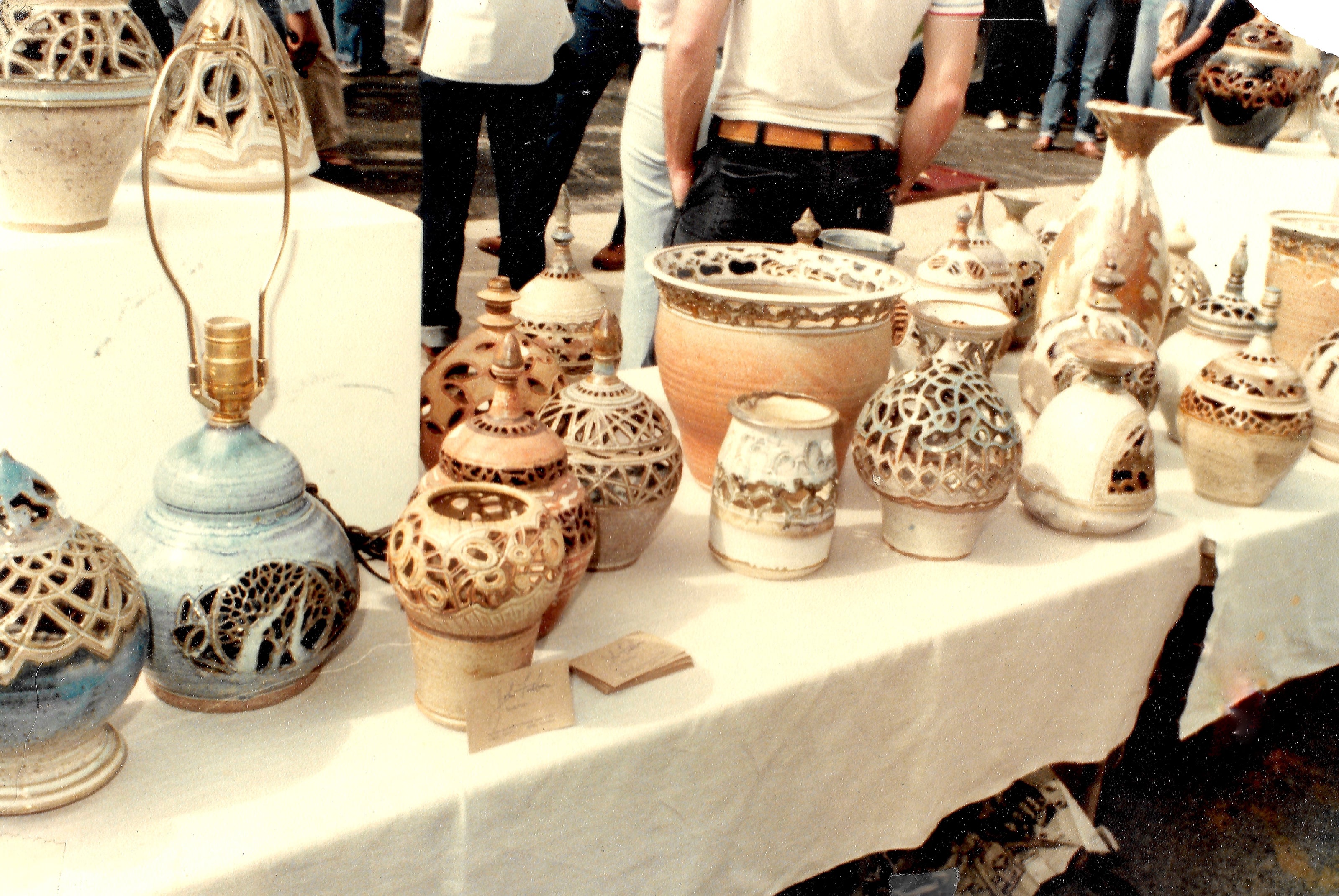 Hand carved ceramic lanterns by John Foelber at an outdooor art festival. Mid 1970's